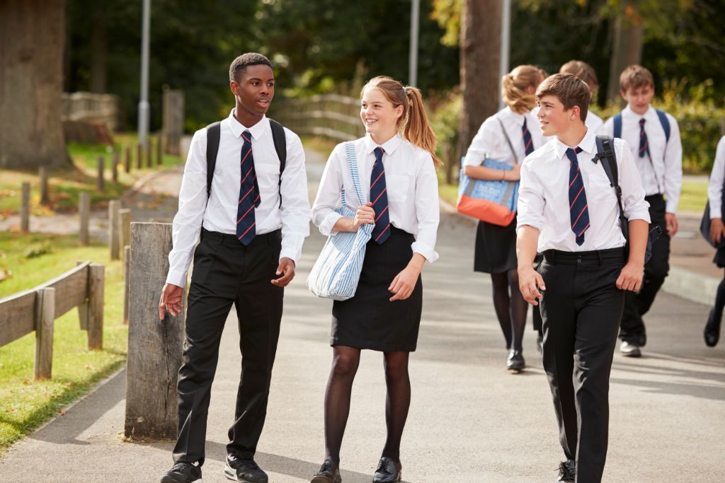 students wearing uniform outside school building