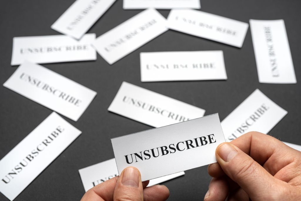 person holding unsubscribe ticket